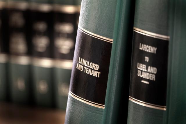 Landlord and tenant reviewing a lease agreement